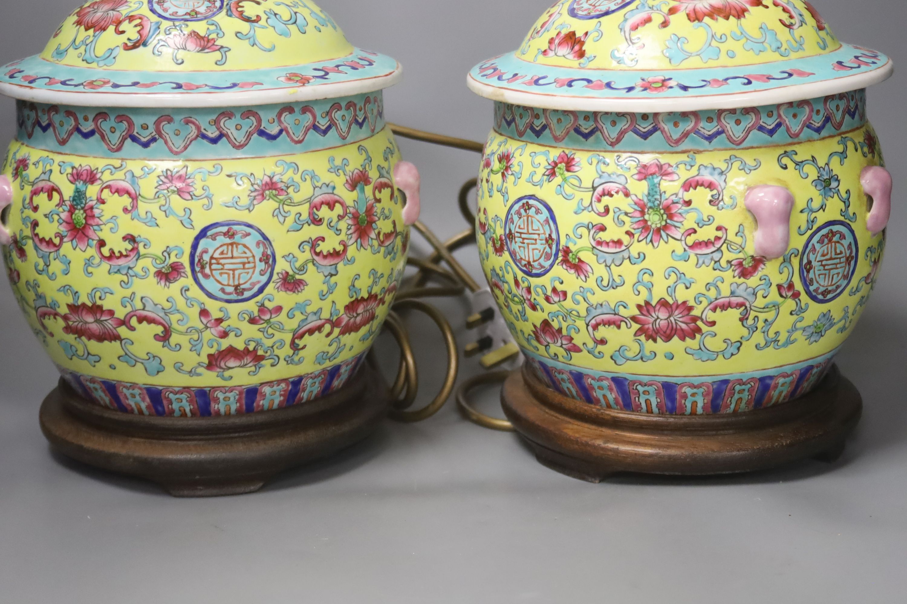 A pair of Chinese yellow ground porcelain table lamps, height 25cm excl. light fittings